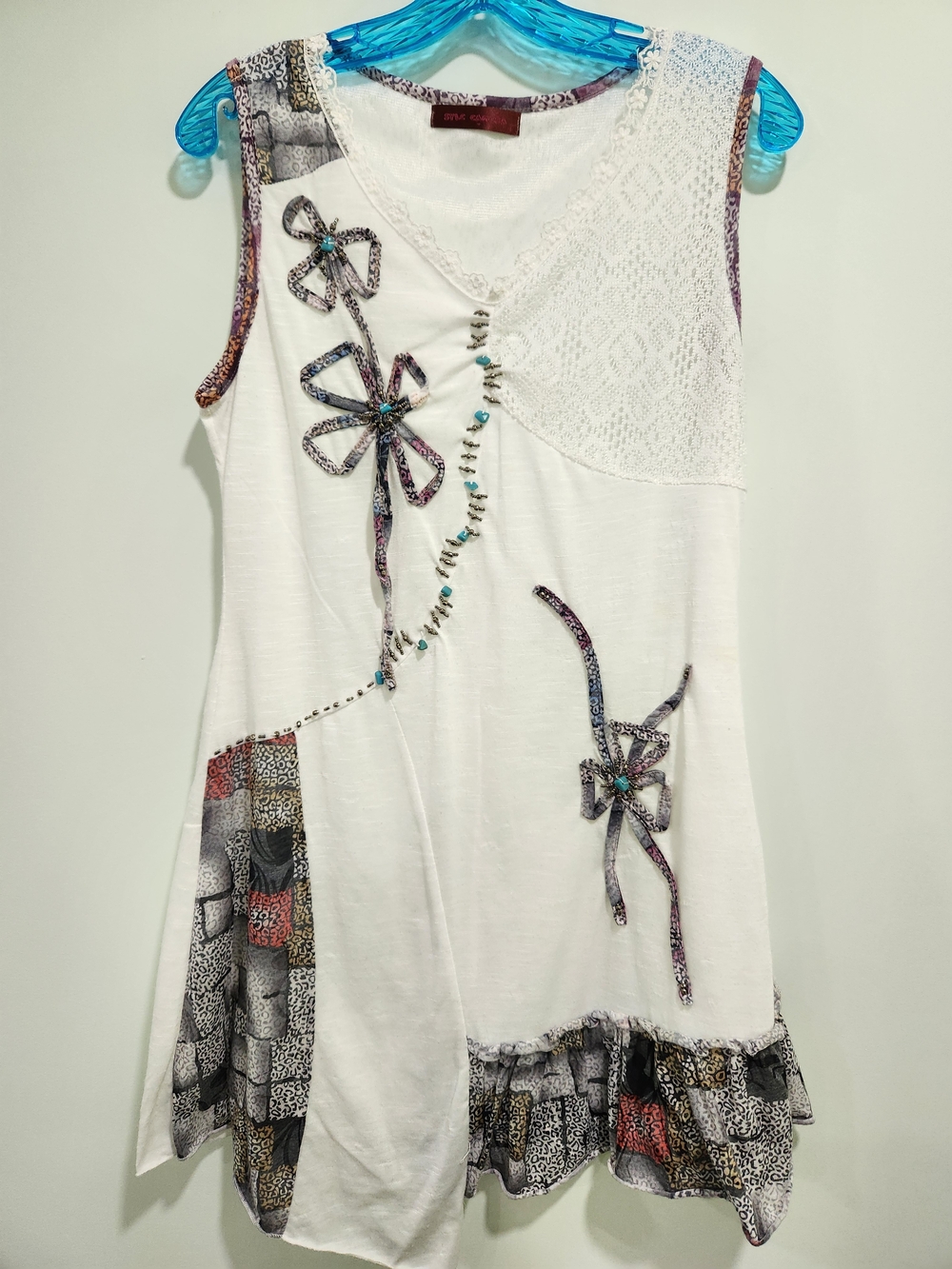 White Sleeveless Mini Dress with Decorative Floral Ribbon Accents